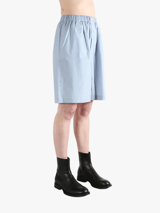 Blue shorts worn by a person, showing the shorts' fit