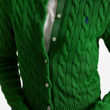 Close up of green cardigan, showing texture of the cotton fabric