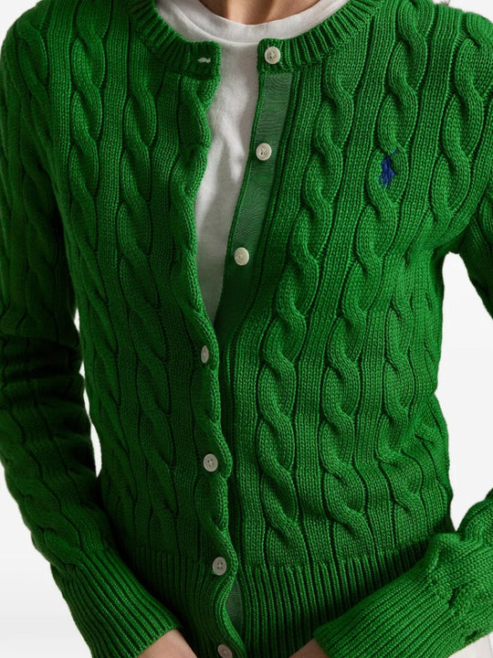 Close up of green cardigan, showing texture of the cotton fabric