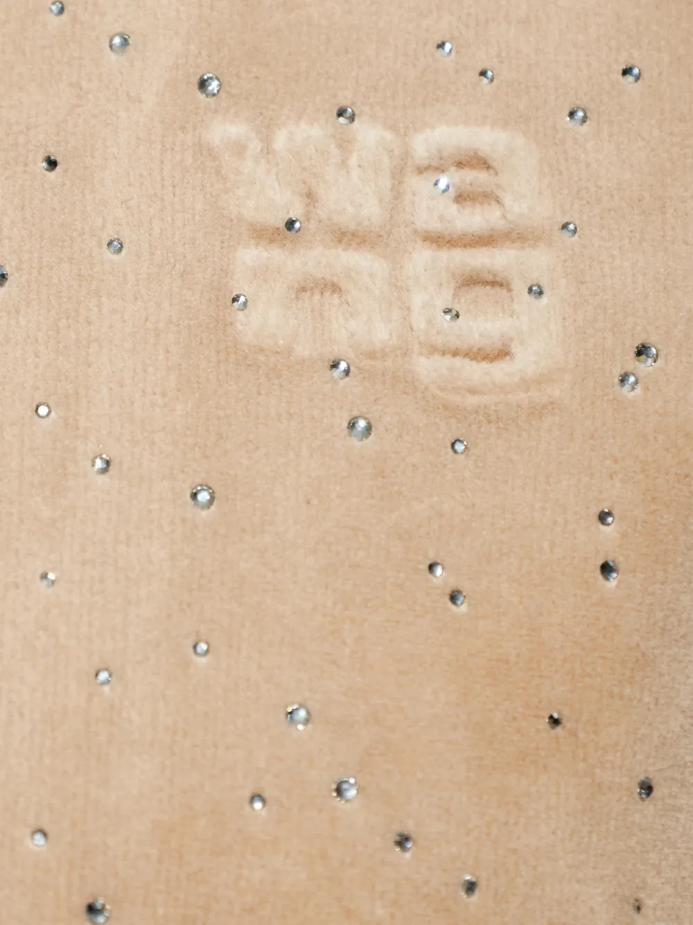 Close up of tan hoodie,showing texture of the cotton fabric.