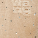 Close up of tan hoodie,showing texture of the cotton fabric.