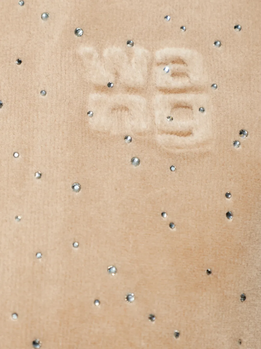 Close up of tan hoodie,showing texture of the cotton fabric.