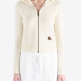 White jacket worn by a person, showing the jacket fit