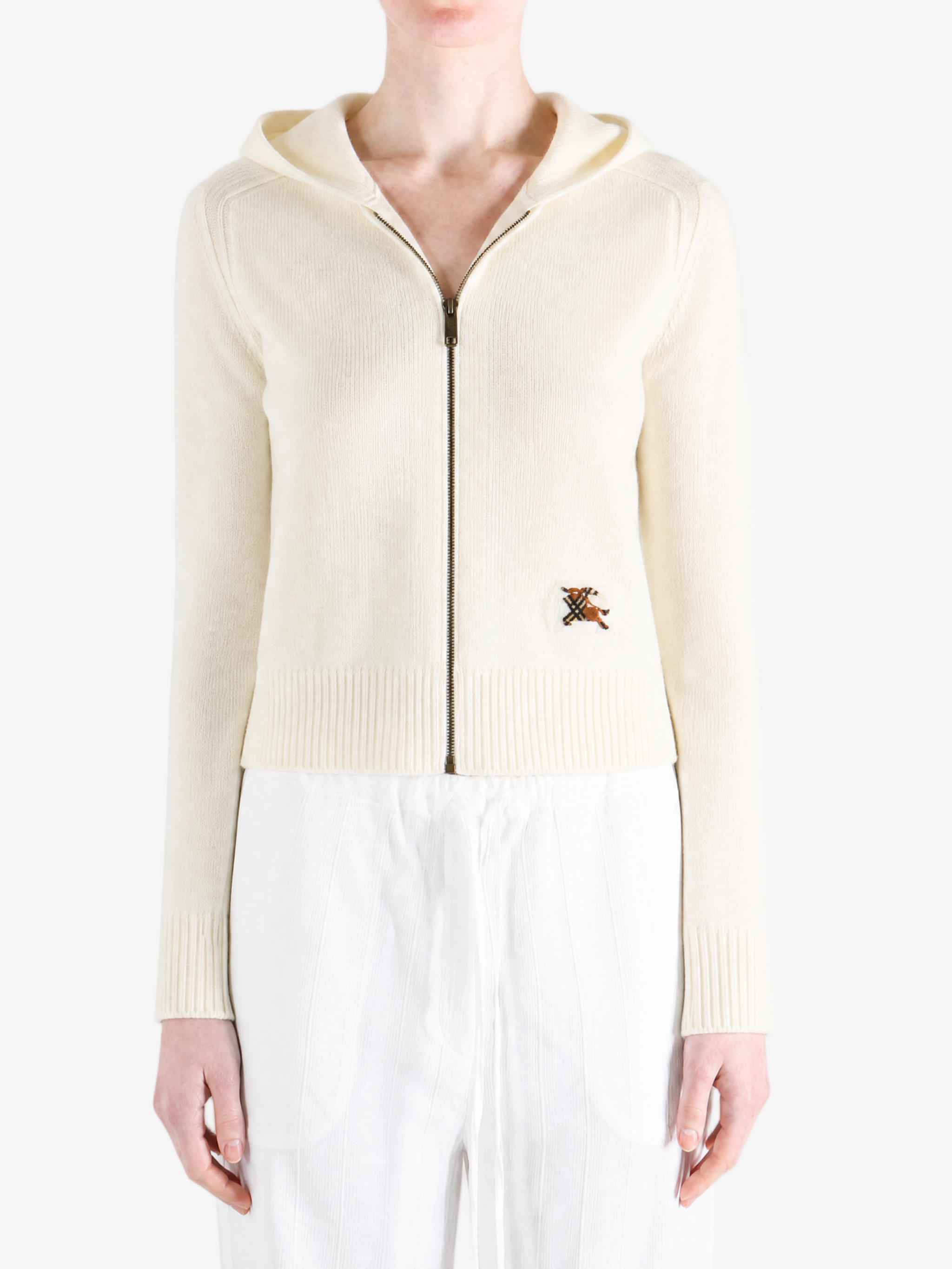 White jacket worn by a person, showing the jacket fit