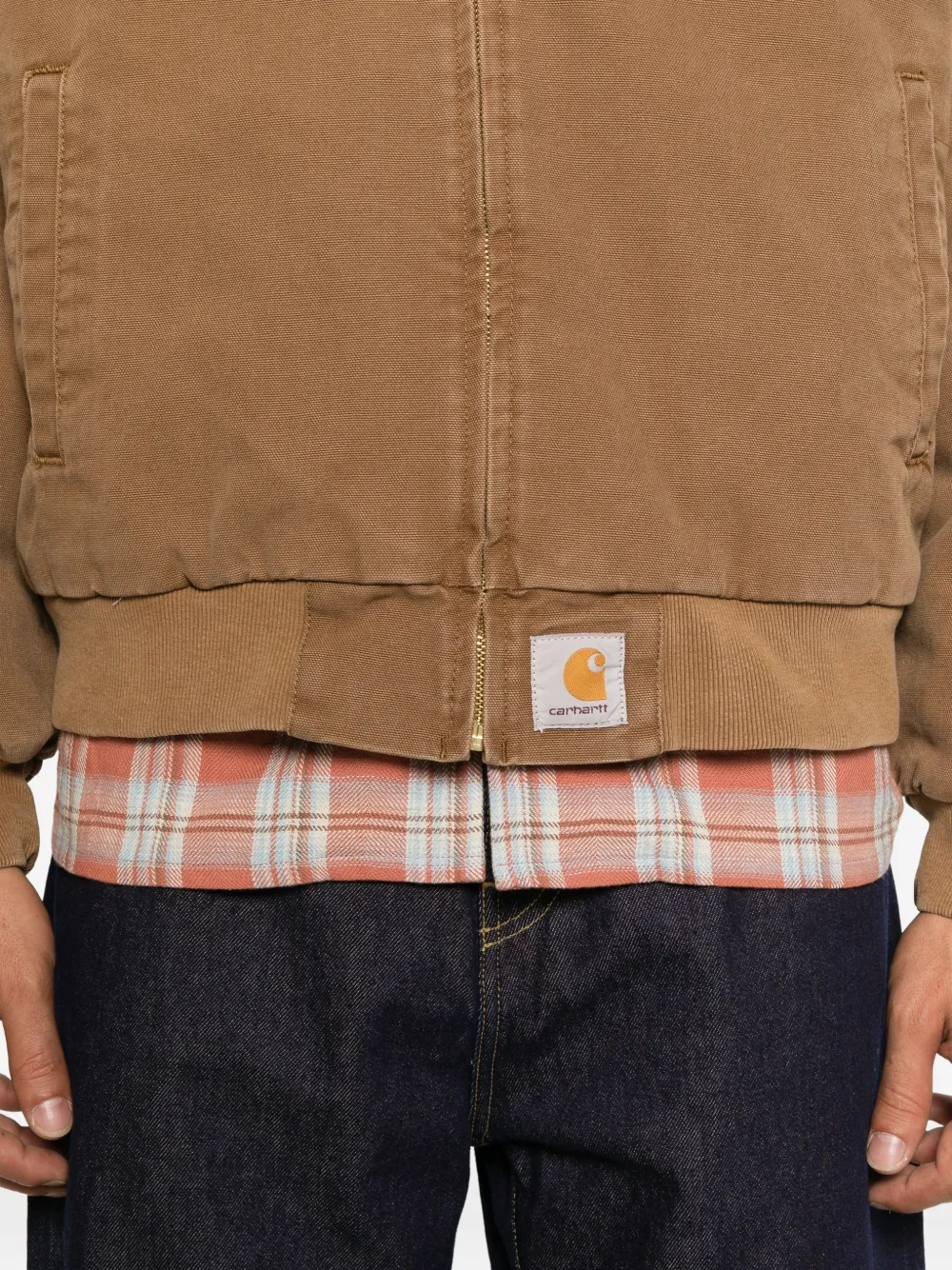 Brown jacket worn by a person, showing the jacket fit