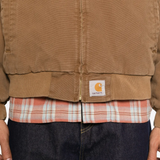 Brown jacket worn by a person, showing the jacket fit
