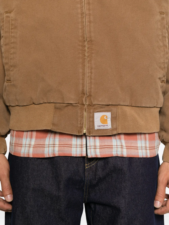 Brown jacket worn by a person, showing the jacket fit