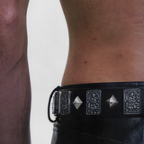 Black accessories worn by a person, showing the accessories fit