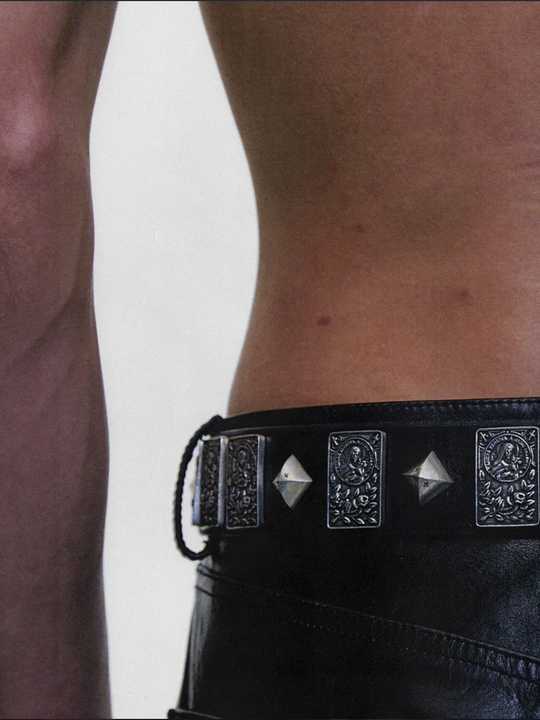 Black accessories worn by a person, showing the accessories fit