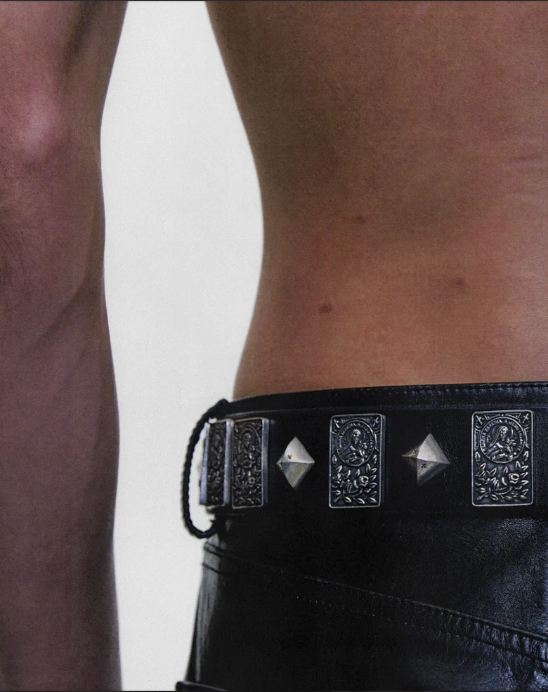 Black accessories worn by a person, showing the accessories fit