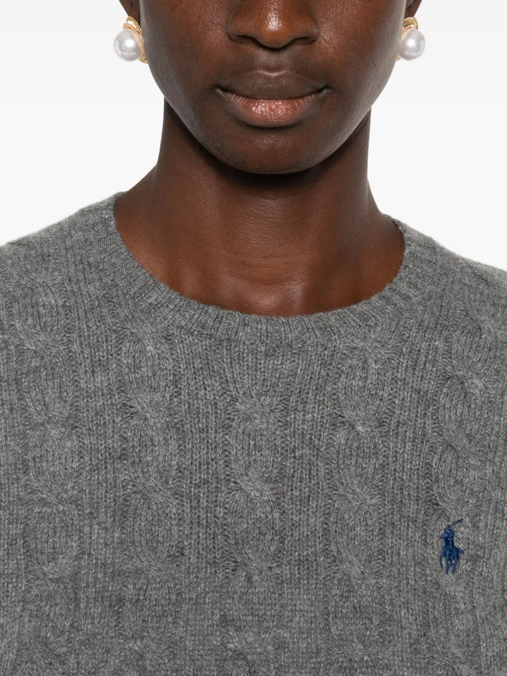 Close up of grey sweater, showing texture of the wool fabric