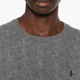 Close up of grey sweater, showing texture of the wool fabric