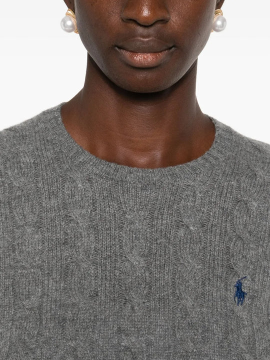 Close up of grey sweater, showing texture of the wool fabric