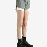 Grey shorts worn by a person, showing the shorts's fit