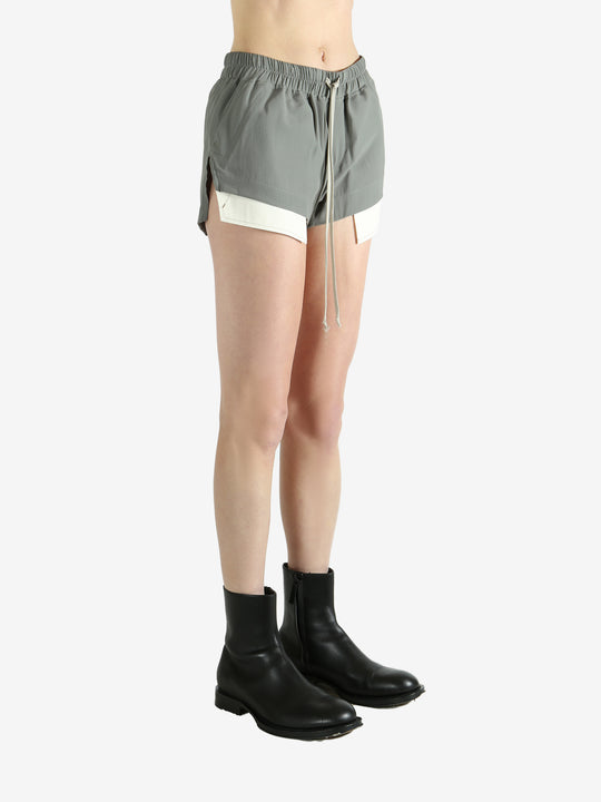 Grey shorts worn by a person, showing the shorts's fit