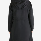 Black coat worn by a person, showing the coat fit