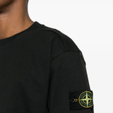 Black hoodie worn by a person, showing the hoodie fit