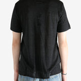 Black shirt worn by a person, showing the shirt fit