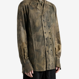 Brown shirt worn by a person, showing the shirt fit