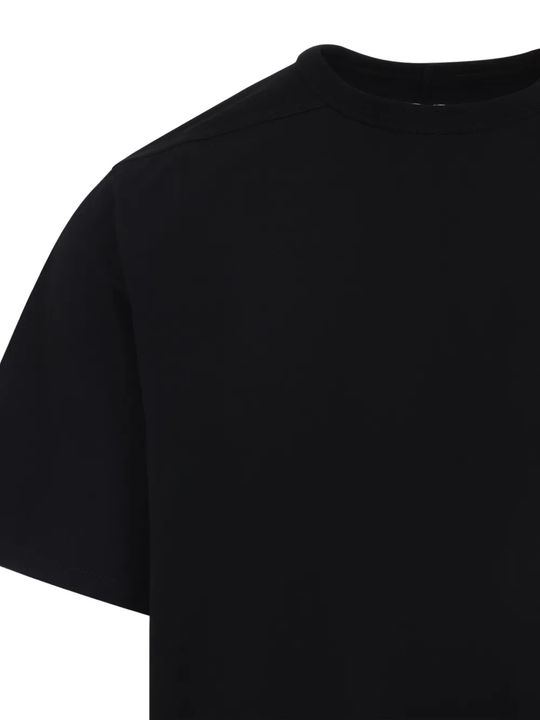 Close up of black t-shirt, showing texture of the cotton fabric