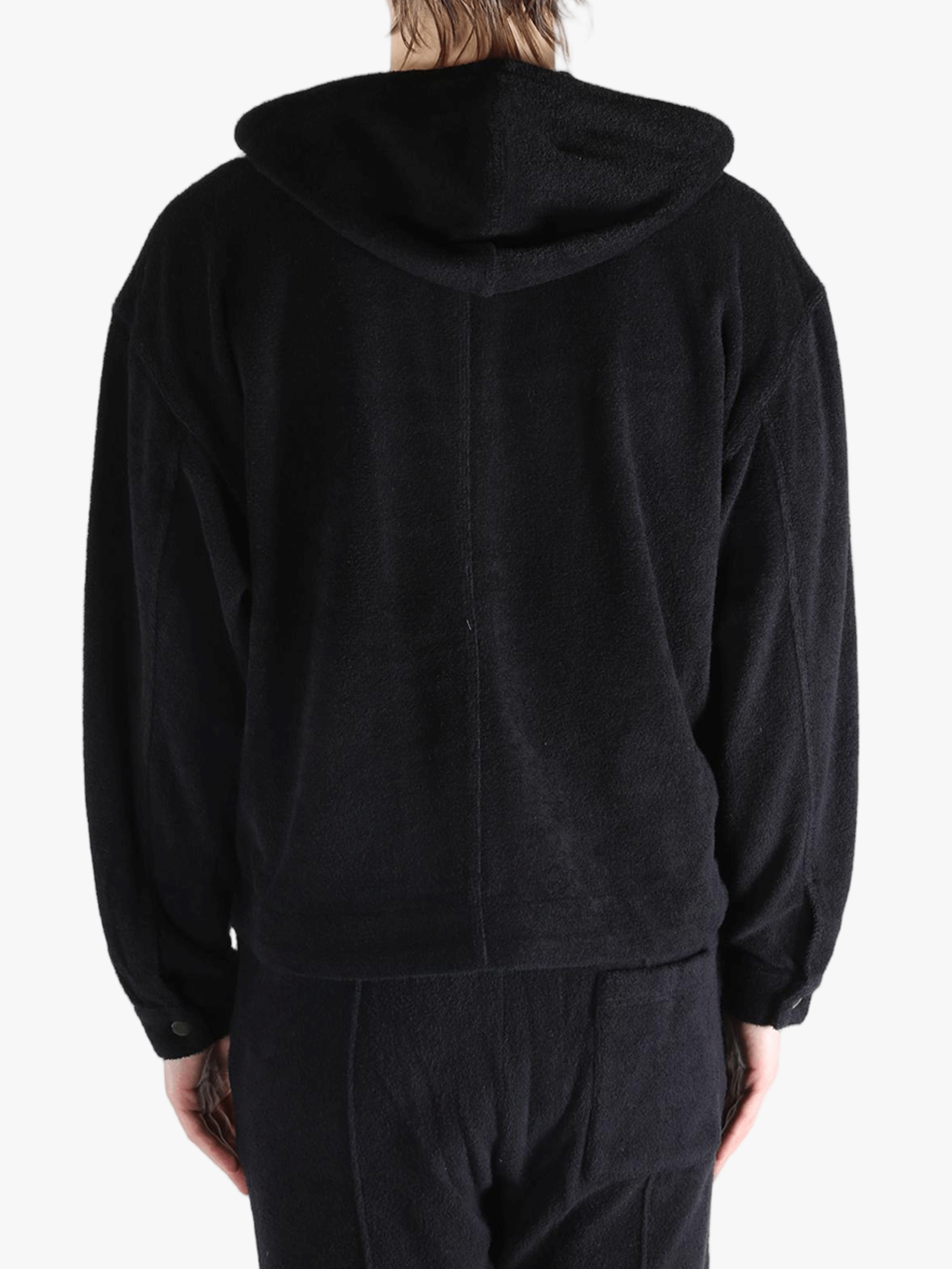 Black jackets worn by a person, showing the jackets fit