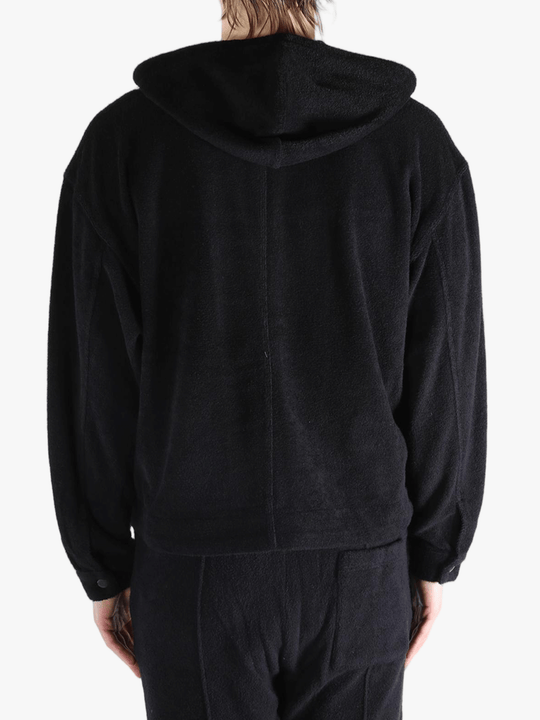 Black jackets worn by a person, showing the jackets fit