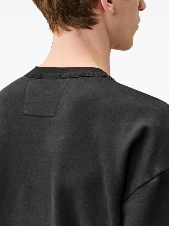 Black hoodie worn by a person, showing the hoodie fit