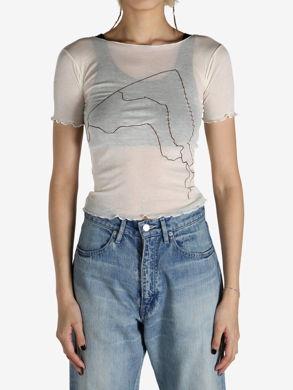 White shirt worn by a person, showing the shirt‘s fit