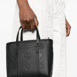 Black bag worn by a person, showing the bag's fit