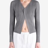 Grey knitwear worn by a person, showing the knitwear fit