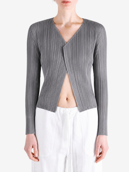 Grey knitwear worn by a person, showing the knitwear fit