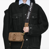 Tan bag worn by a person, showing the bag fit