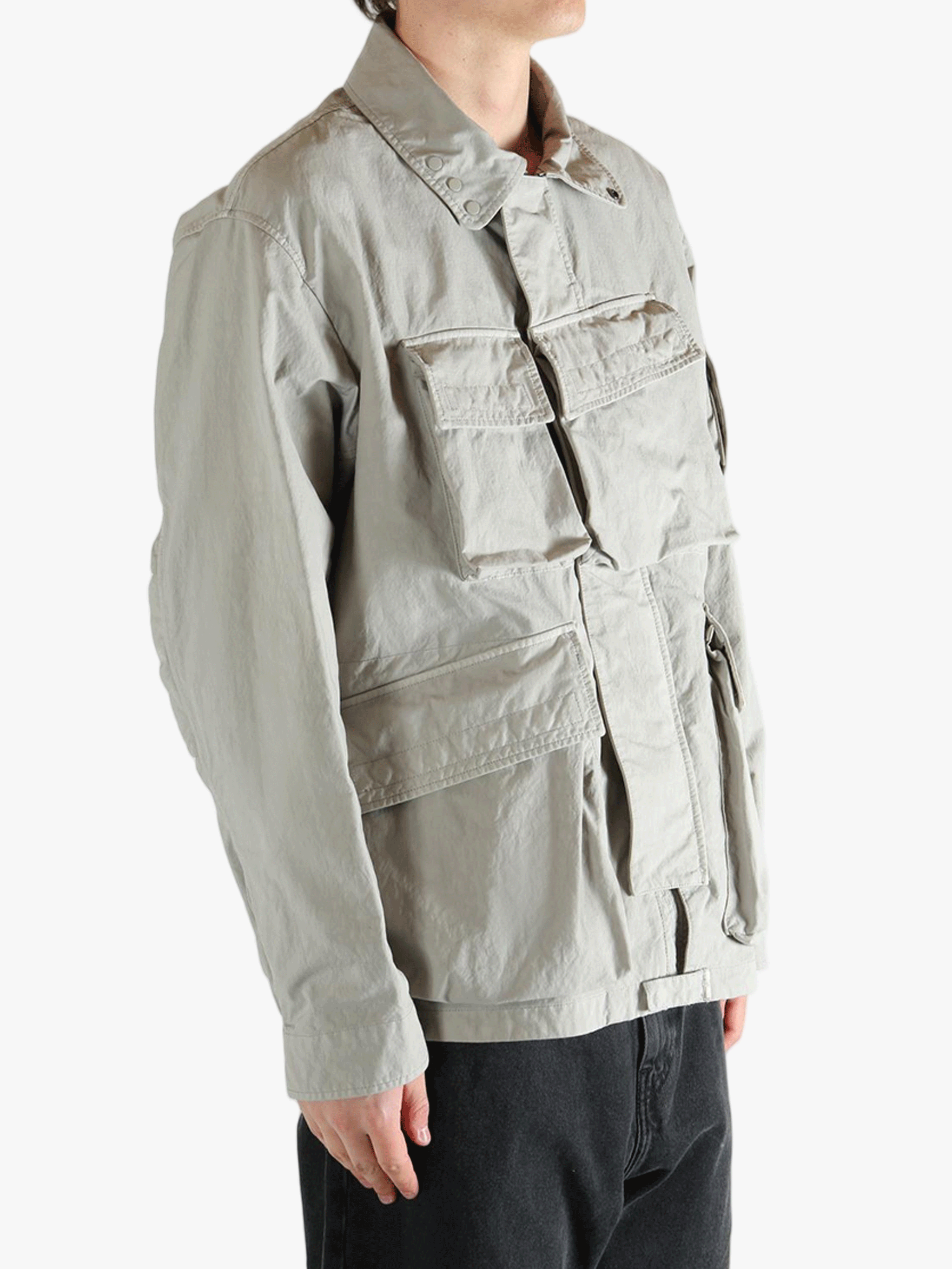 Grey jacket worn by a person, showing the jacket fit