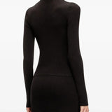 Black knitwear worn by a person, showing the knitwear's fit