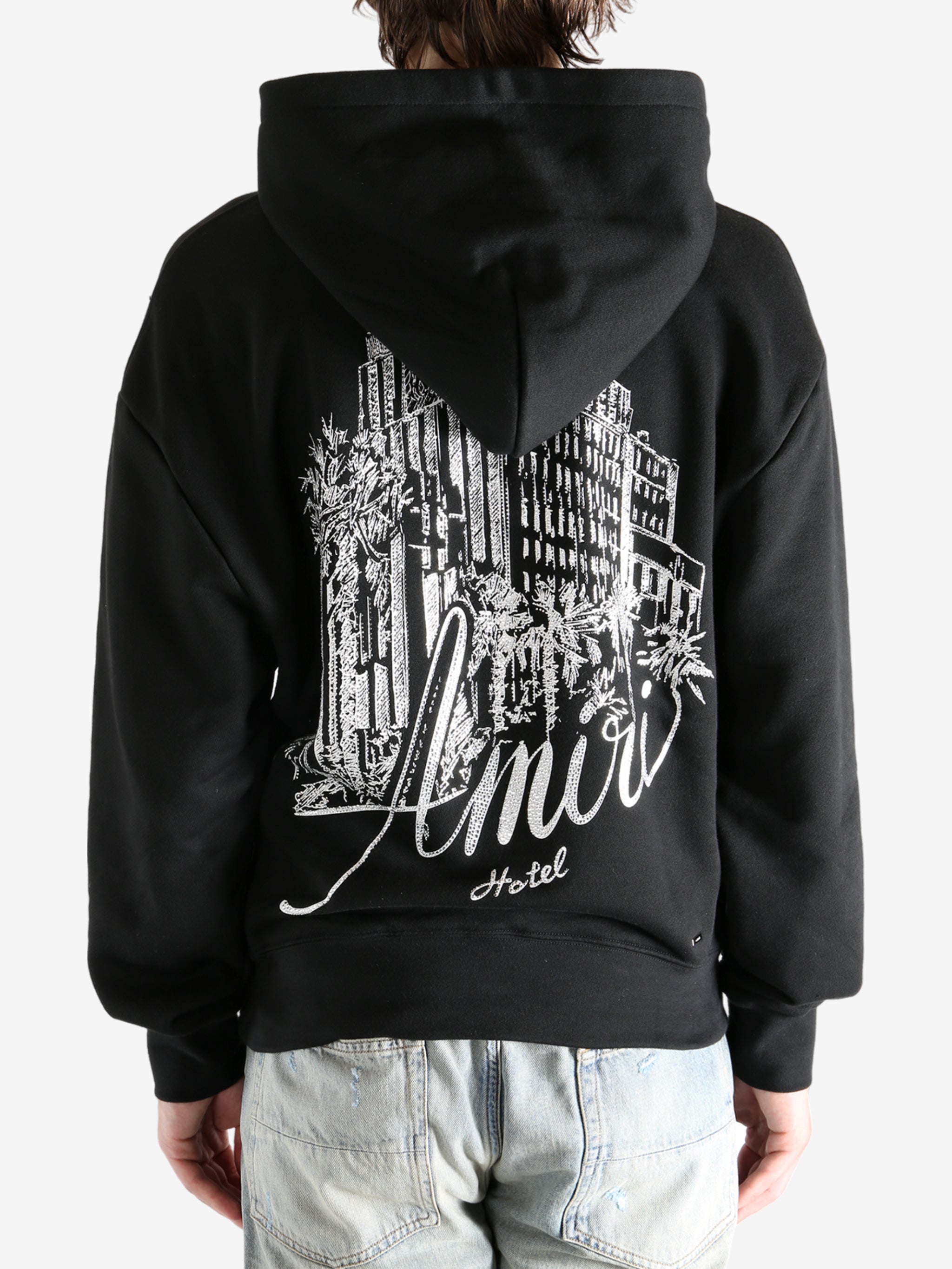 Black hoodie worn by a person, showing the hoodie fit