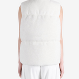 White top worn by a person, showing the top fit