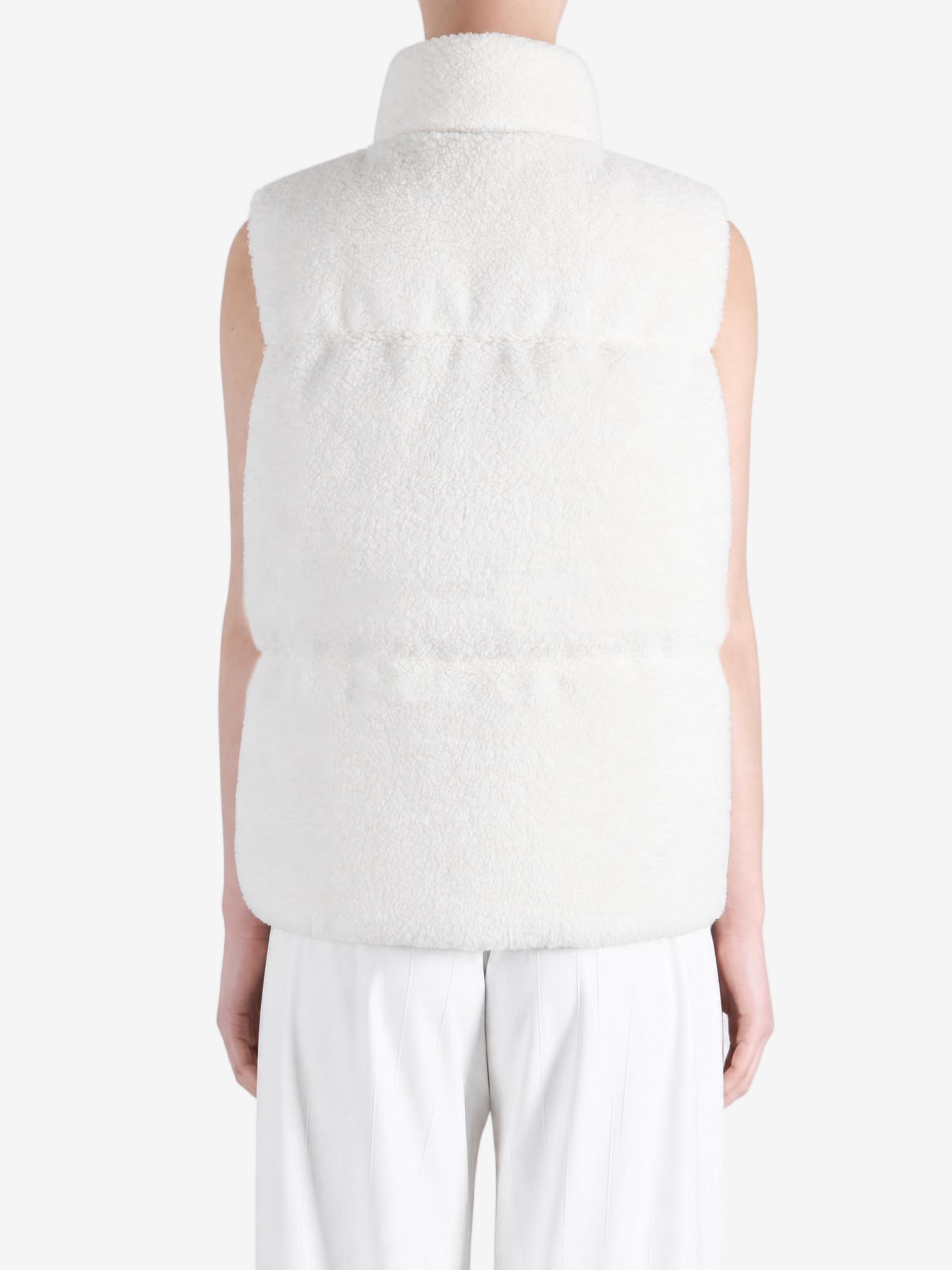 White top worn by a person, showing the top fit