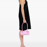 Pink bags worn by a person, showing the bags's fit