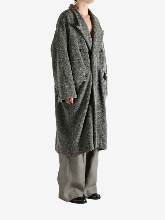 Grey coat worn by a person, showing the coat's fit