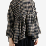 Navy shirt worn by a person, showing the shirt's fit