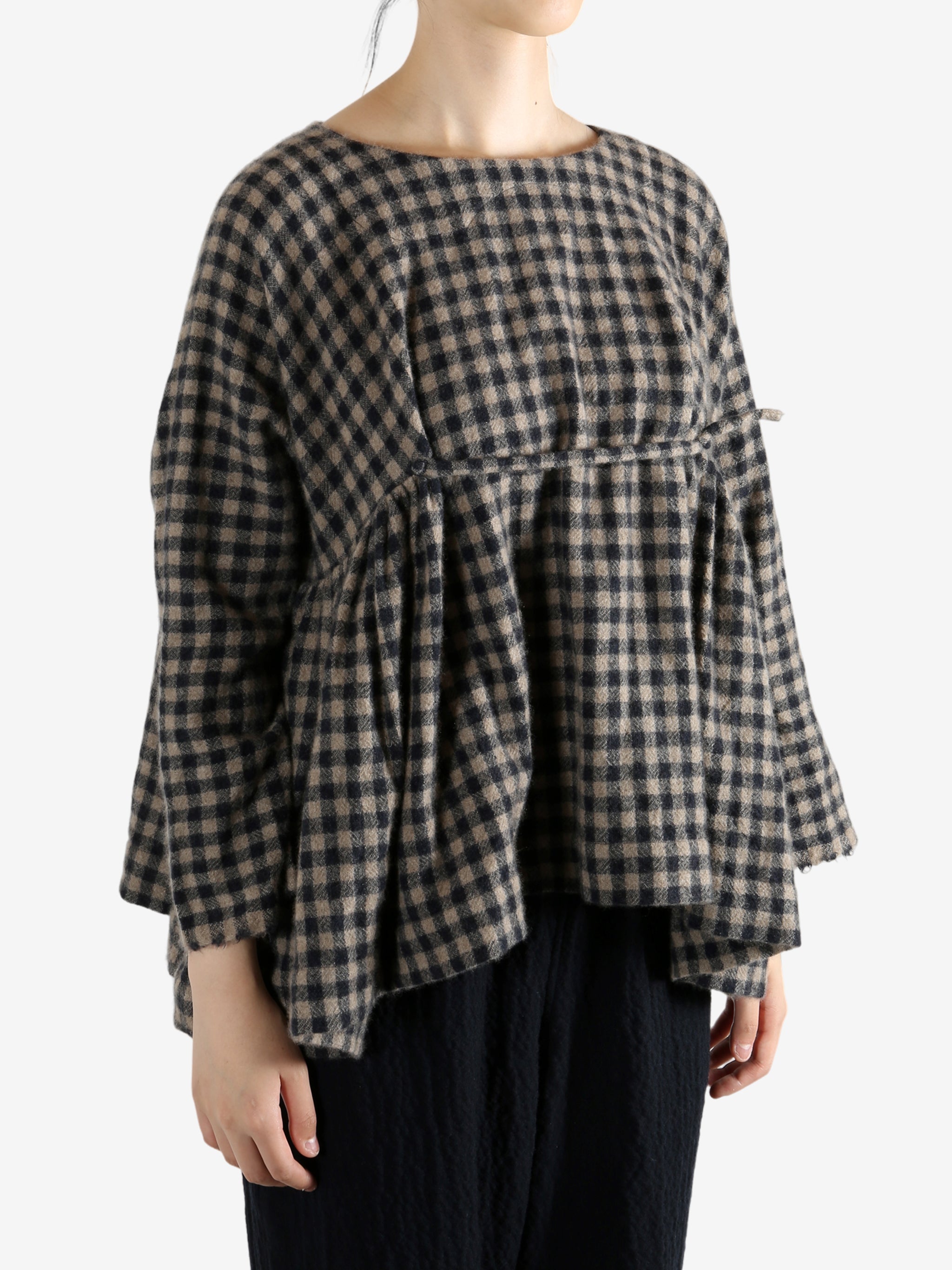 Navy shirt worn by a person, showing the shirt's fit