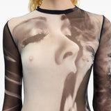 Black top worn by a person, showing the top fit