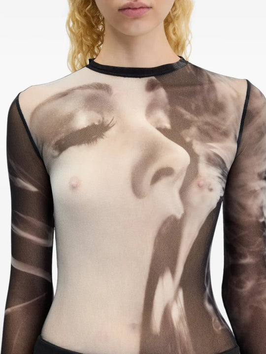 Black top worn by a person, showing the top fit