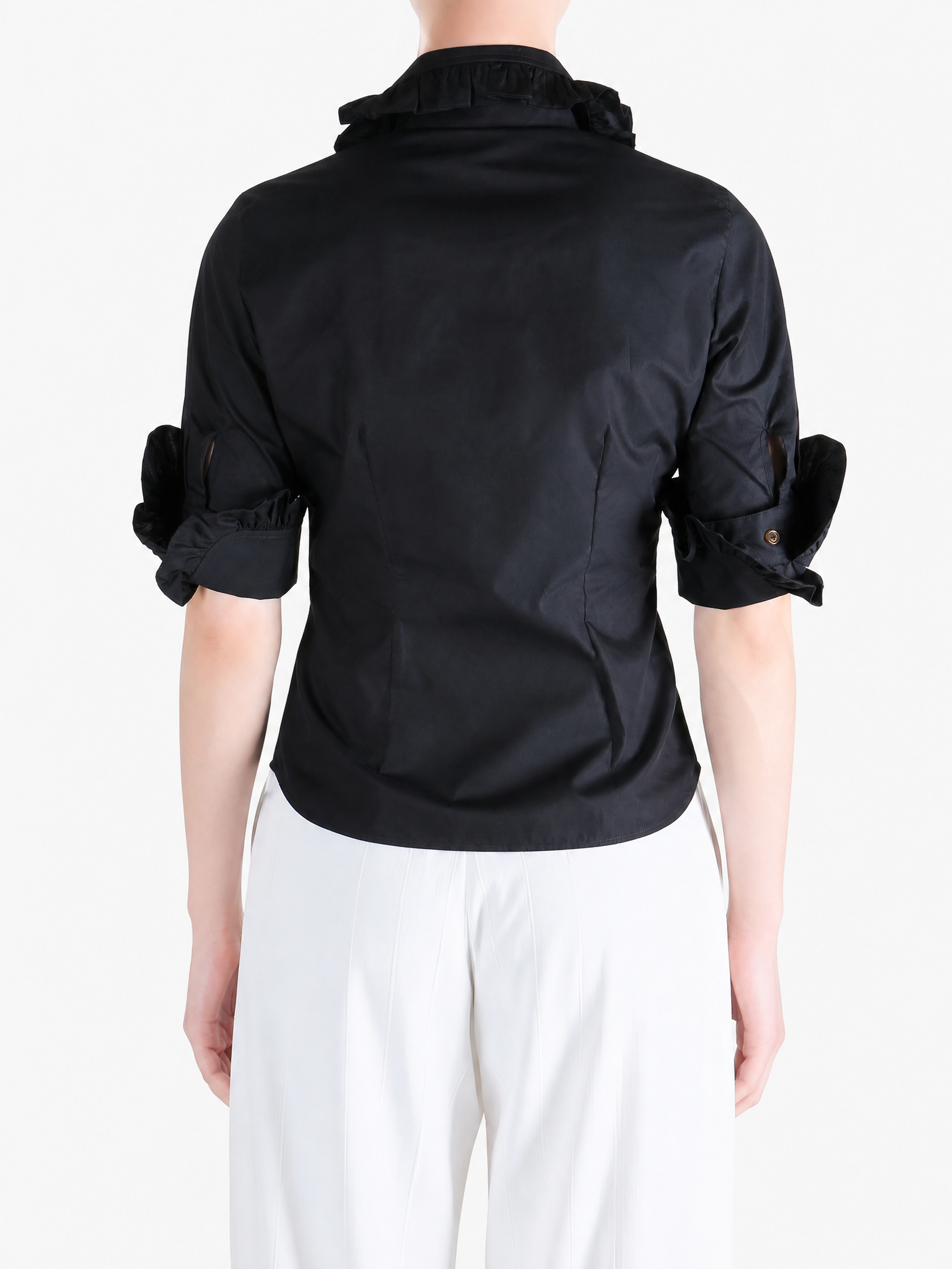 Black shirt worn by a person, showing the shirt fit