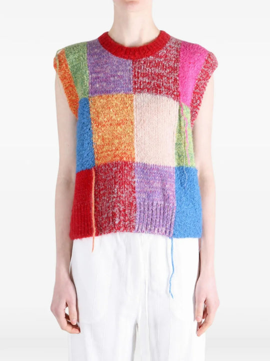 Red knitwear worn by a person, showing the knitwear fit