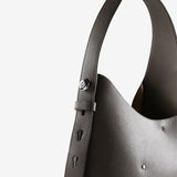 Close up of brown bag, showing texture of the leather fabric