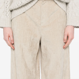 Tan pants worn by a person, showing the pants fit