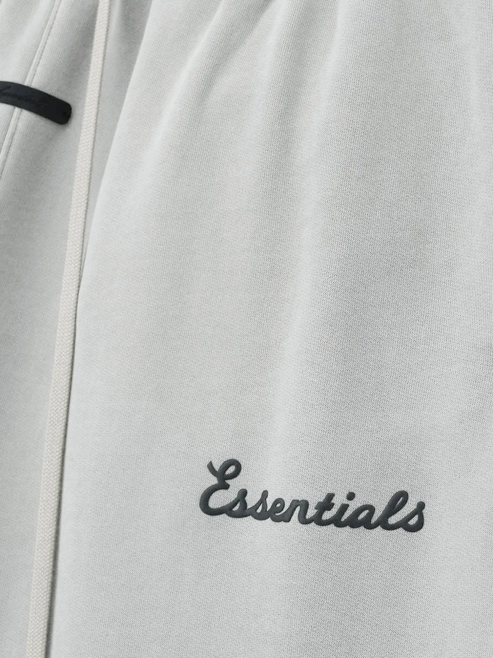 Close up of white pants, showing texture of the cotton fabric