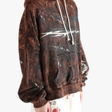 Brown hoodie worn by a person, showing the hoodie's fit