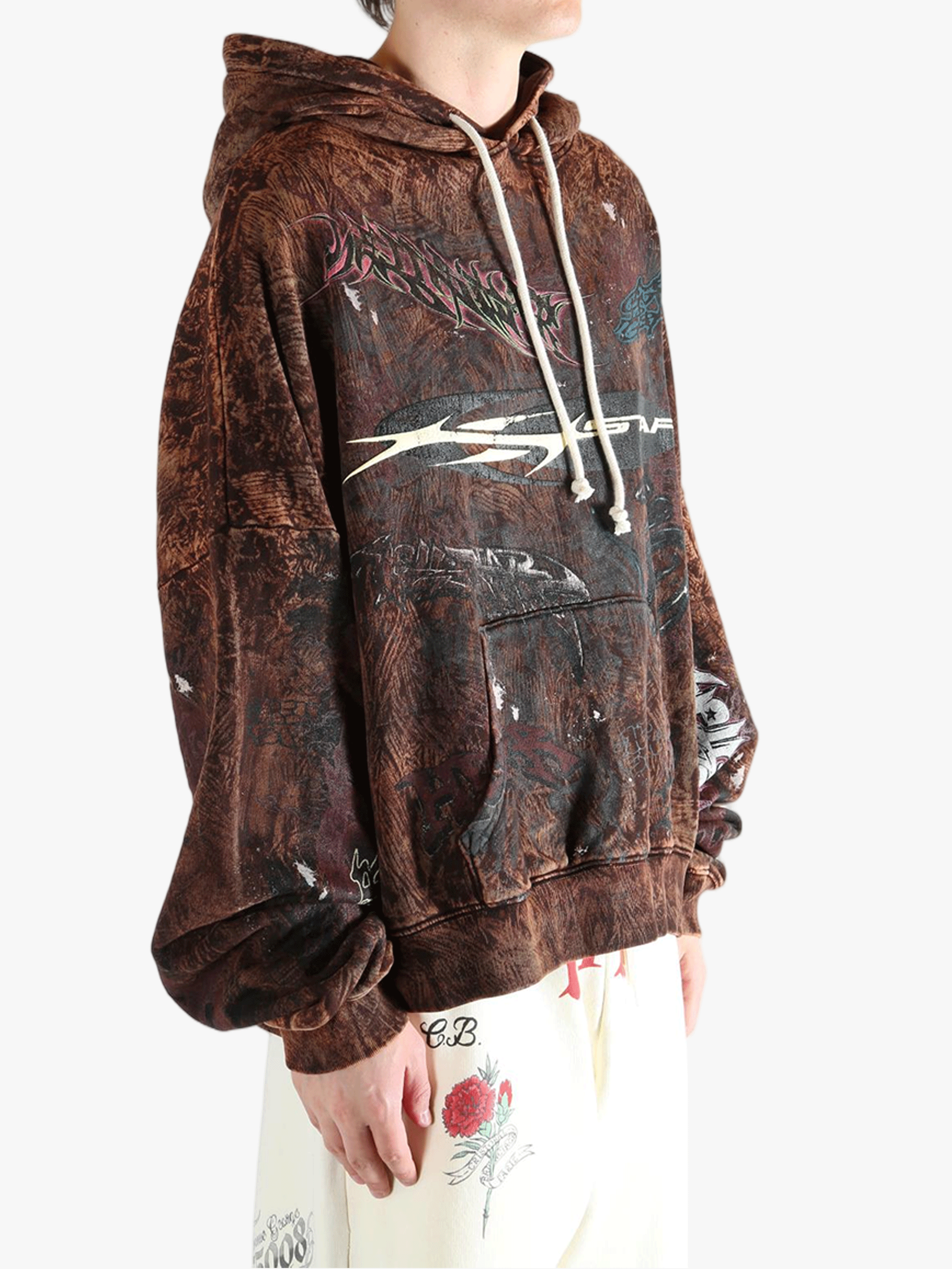 Brown hoodie worn by a person, showing the hoodie's fit